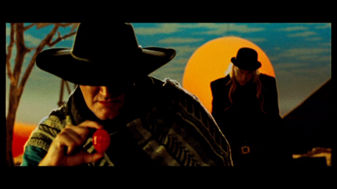 Tarantino holding red egg
